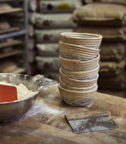 bowl of flour and stack of baskets